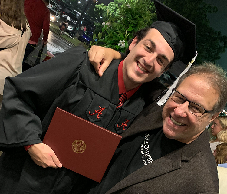 This image has an empty alt attribute; its file name is Dad-and-jordan-graduation.jpg